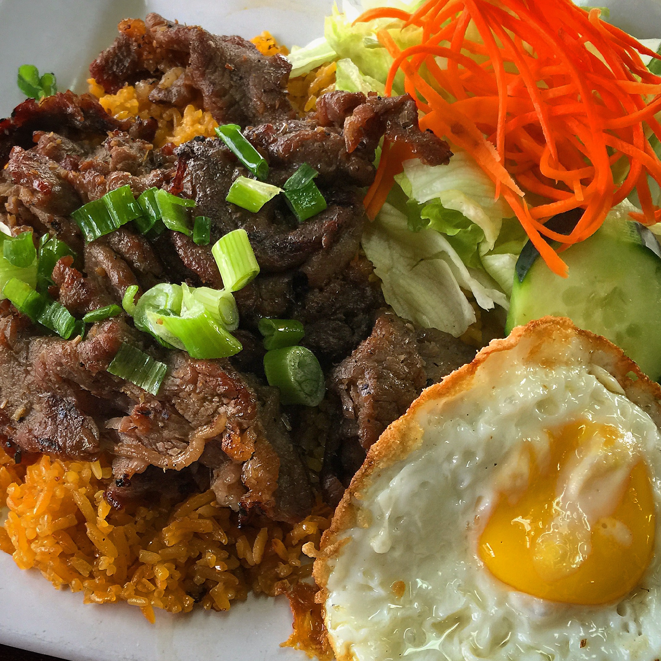 #45 - Special Yellow Rice, with Beef, plus a fried egg for an extra $1.35